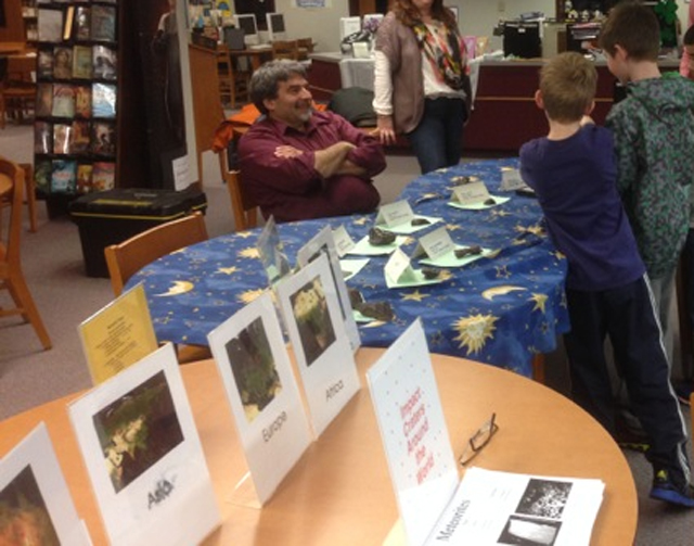 Al Washburn presents the ASNH collection of meteorites to students. (Photo by Greg Barker)