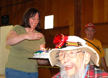 Photo by Stacey Severn
Cheryl Barker gets John Dobson's cake ready to give to him for his birthday.
