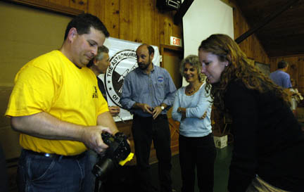 Photo by Alan Chaniewski
Greg Barker showing photos to our speakers.
