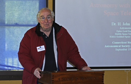 Photo by Alan Chaniewski
Dr. H. John Wood from the NASA Goddard Space Center, Optics Lead Engineer who developed the corrective optics for the Hubble Space Telescope giving a great lecture.
