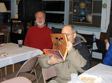 Photo by Alan Chaniewski
Winter Solstice party 12/13/08 - Ruben checking out a new book before dinner.
