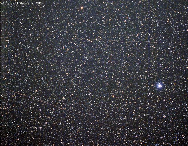 Two meteors passing through Draco by Vladimir Ilic
Lower left is Antihelion meteor, upper is sporadic, bright star is Vega
Zenit 122K camera, 50mm f/2.8 lens, Kodak Max 800 film, CG-5 mount
15 min exposure, processed with AstroArt 3.0 and Photoshop
