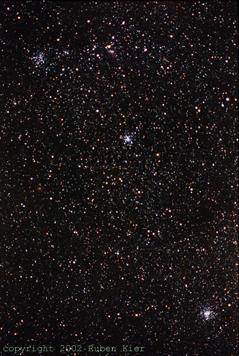 Messier 36,37,38 Taken by Ruben Kier
M38 (top), M36 (middle), and M37 (bottom) in Auriga
Taken by Ruben Kier 11/22 in New Mexico
300 mm f/4.5 Pentax telephoto camera lens piggyback,
Kodak 1000 color print film, 20 minute exposure.


