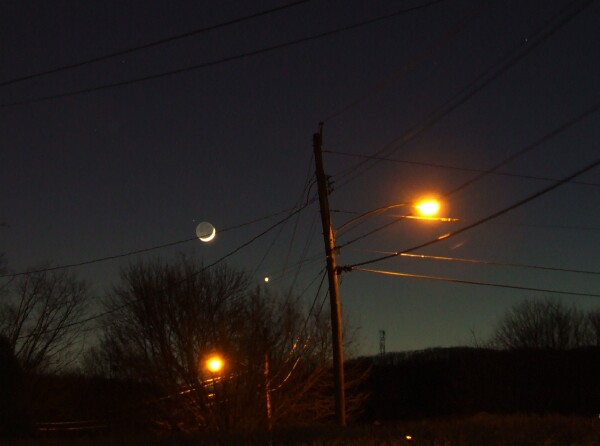 Photo by Eleanor Andujar
A beautiful picture of the setting moon with Venus to it's right taken on January 20, 2007. Taken with a Fuji 
S-5200 from the driveway of our house.



