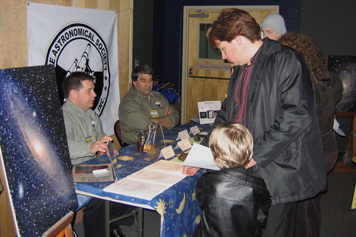Photo by Alan Chaniewski
Peabody Museum - 3/31/07 - Greg Barker and Al Washburn talk with a visitors at the ASNH table at the Alien Earth's exhibit. 

