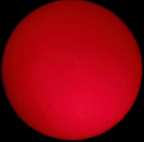 Solar image by Walt Kupson
Sun Filaments in Hydrogen Alpha taken by Walter Kupson
In the center is AR 750 with plages (the lightened areas)
surrounding that solitary sunspot.
Coronado PST, 12 mm kellner eyepiece, Canon 3.2 mp camera

