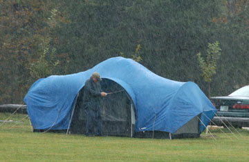 Photo by Alan Chaniewski
The first camper at CSP sets up his tent in the pouring rain.
