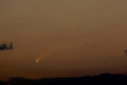 Photo by Alan Chaniewski
Comet McNaught (c/2006/P1) - 1/7/07 - Comet McNaught captured in Hebron, Ct. at 5:10pm, approx 30 minutes after sunset. This comet was very difficult to capture because of it's closeness to the horizon, and constant clouds moving through. Photographed with a Nikon D100, asa of 800 1/8th of a second exposure with a 600mm lens.
Estimated magnitude of 0 to -1. 

